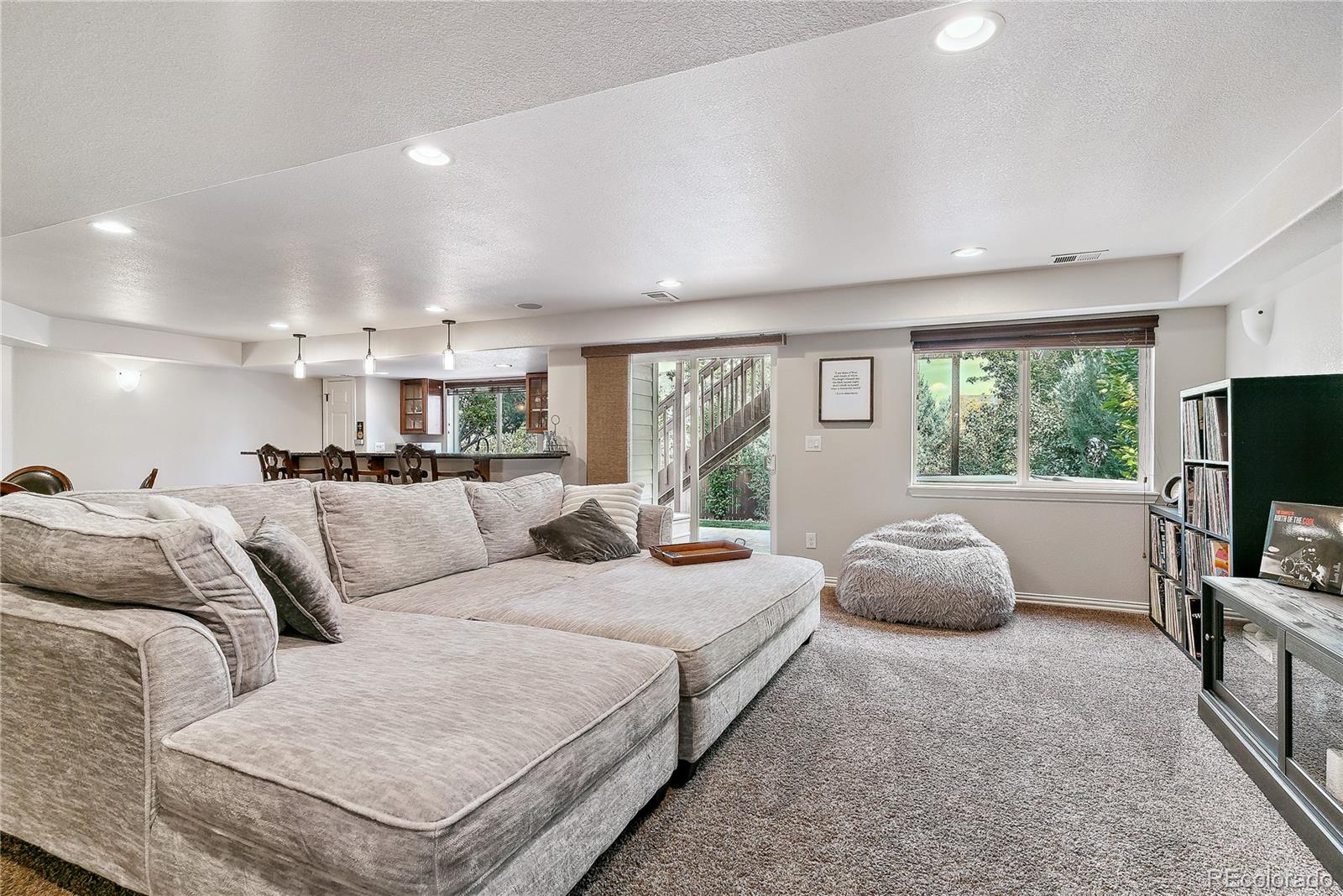 3477 Softwind Point Castle Rock, CO 80108 - Photo 34 of 50 a large bedroom with a bed and large windows