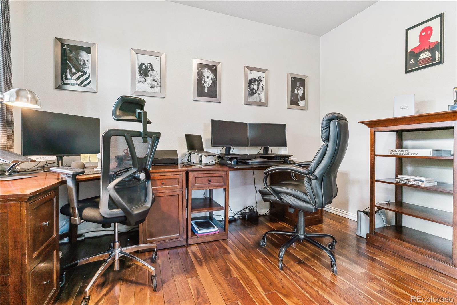 3477 Softwind Point Castle Rock, CO 80108 - Photo 7 of 50 a view of a workspace with furniture and wooden floor