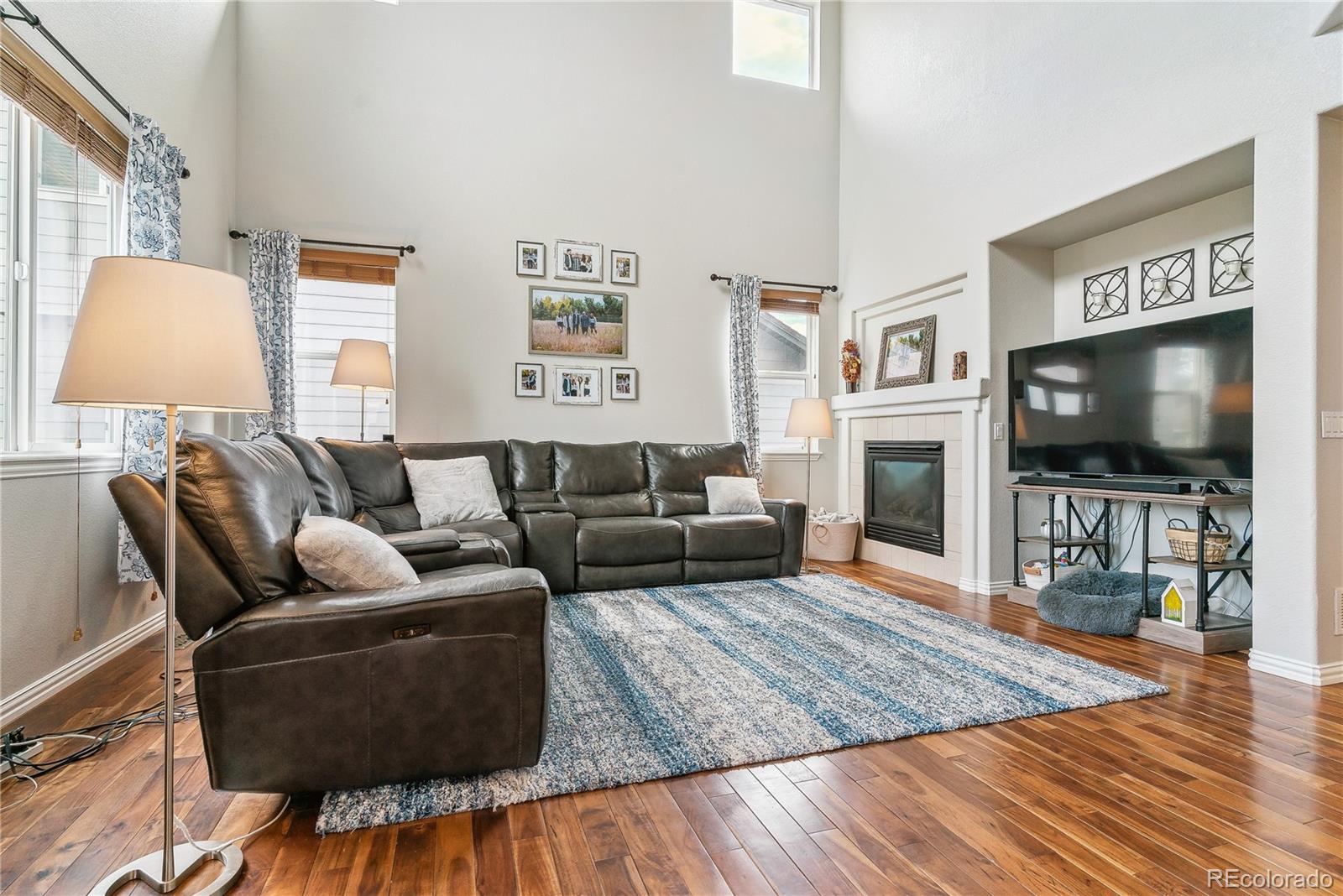 3477 Softwind Point Castle Rock, CO 80108 - Photo 10 of 50 a living room with furniture and a flat screen tv
