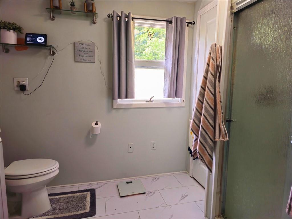 1088 Burns Road Kennerdell, PA 16374 - Photo 30 of 49 a bathroom with a toilet and a shower curtain
