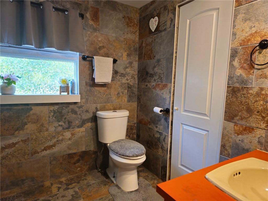 1088 Burns Road Kennerdell, PA 16374 - Photo 34 of 49 a bathroom with a toilet and a sink
