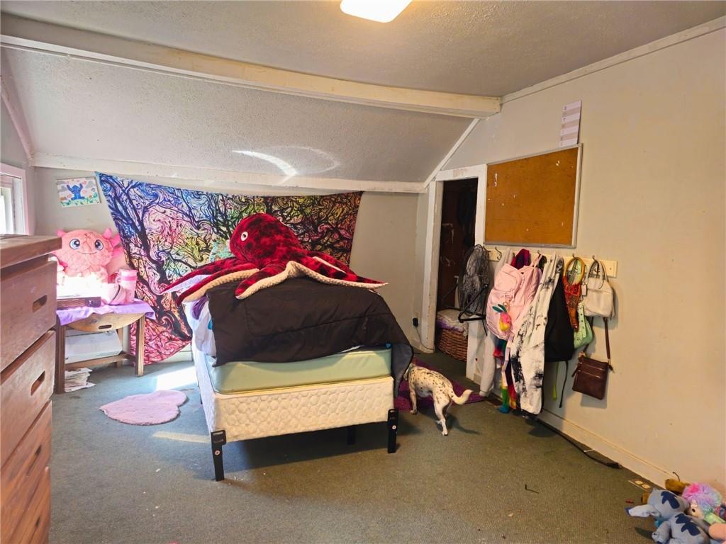 1088 Burns Road Kennerdell, PA 16374 - Photo 35 of 49 a bedroom with a bed and a white walk in closet