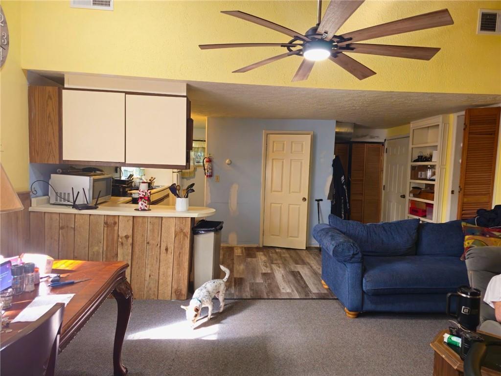1088 Burns Road Kennerdell, PA 16374 - Photo 40 of 49 a living room with furniture a ceiling fan and a window