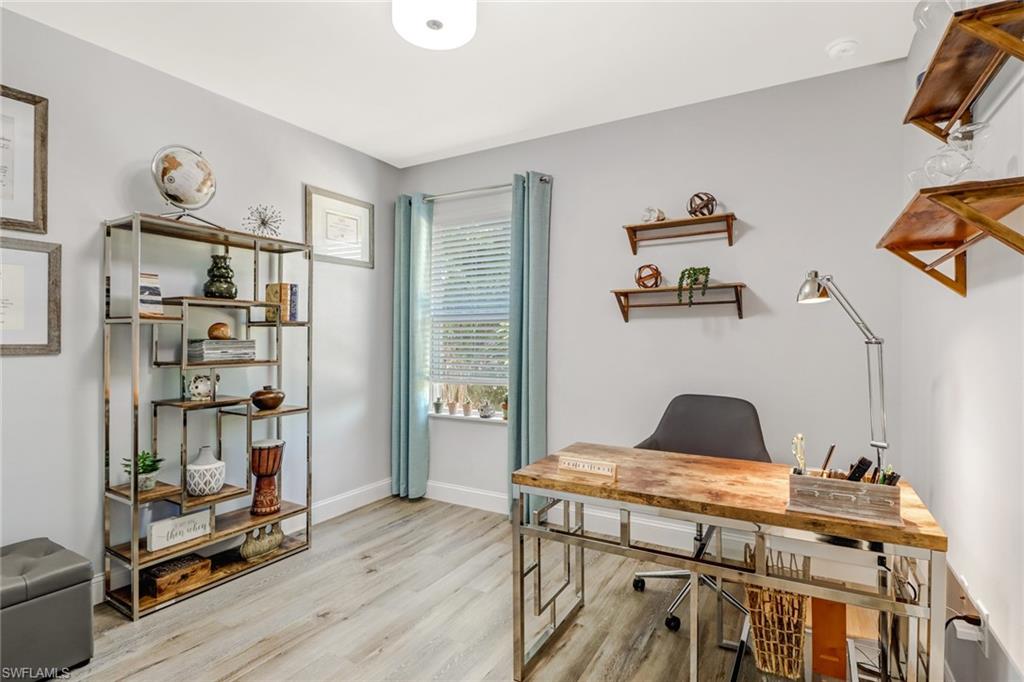 690 Hadley Place East Naples, FL 34104 - Photo 17 of 27 a living room with hard wood flooring and furniture