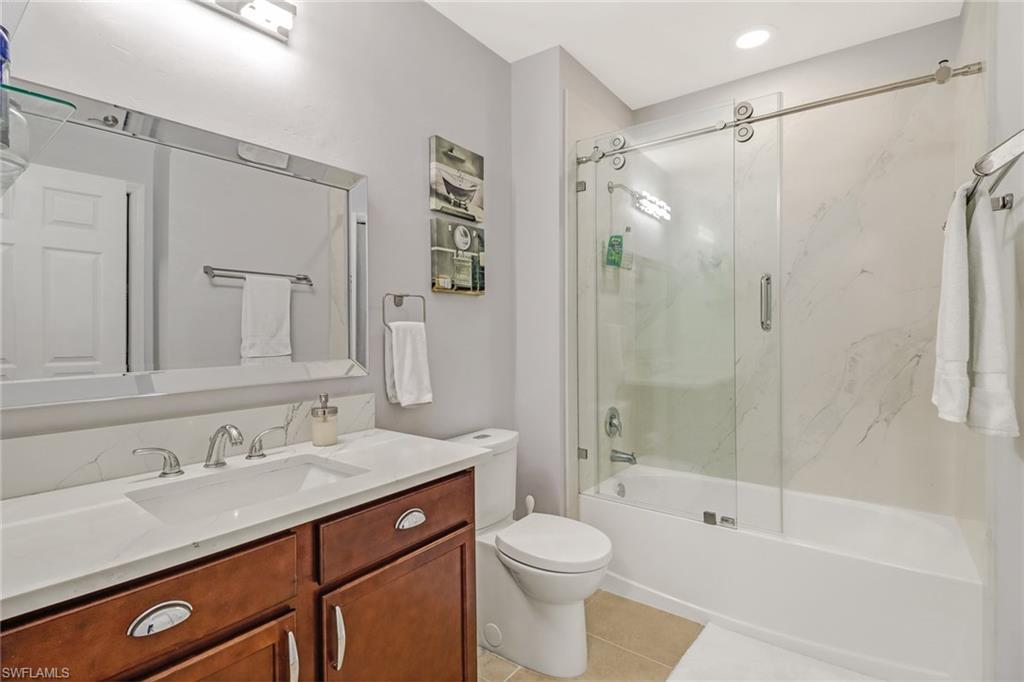 690 Hadley Place East Naples, FL 34104 - Photo 20 of 27 a bathroom with a sink a toilet and shower