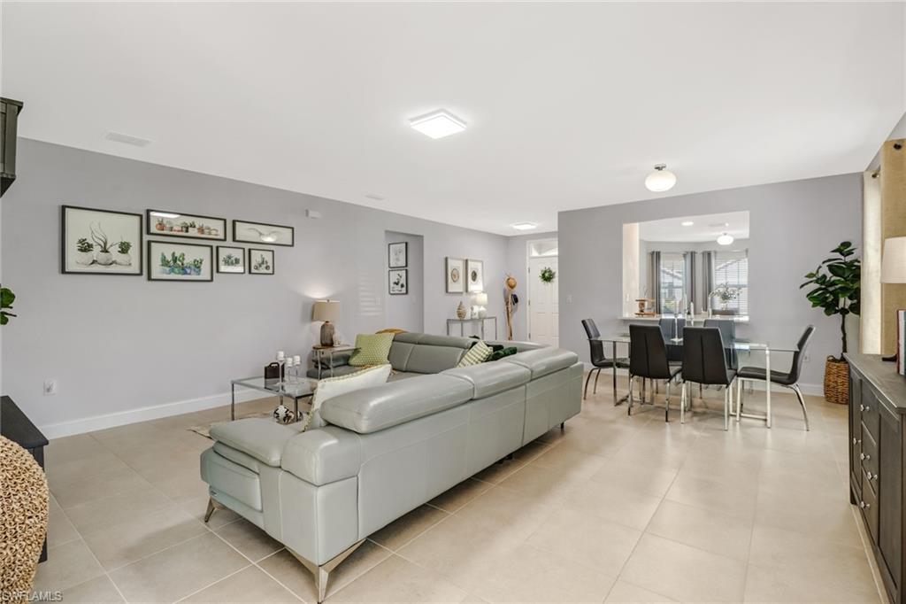 690 Hadley Place East Naples, FL 34104 - Photo 2 of 27 a living room with furniture and view of kitchen