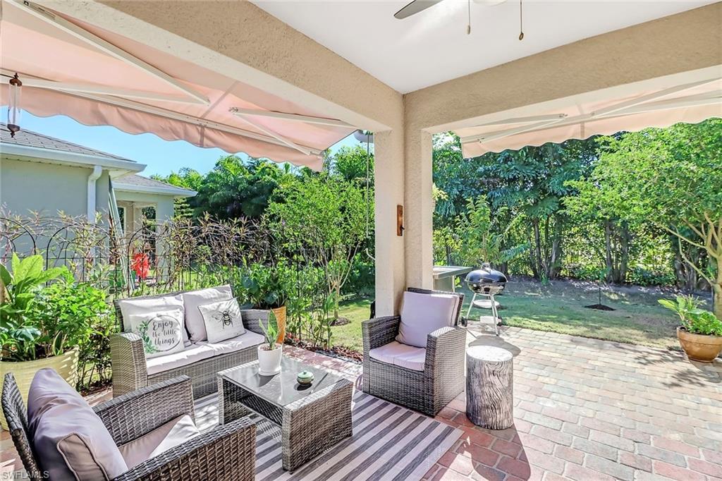 690 Hadley Place East Naples, FL 34104 - Photo 22 of 27 a outdoor living space with furniture and a potted plant