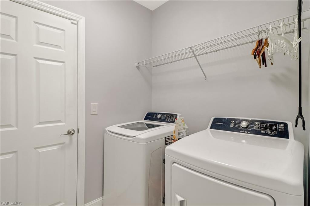 690 Hadley Place East Naples, FL 34104 - Photo 25 of 27 a utility room with dryer and washer