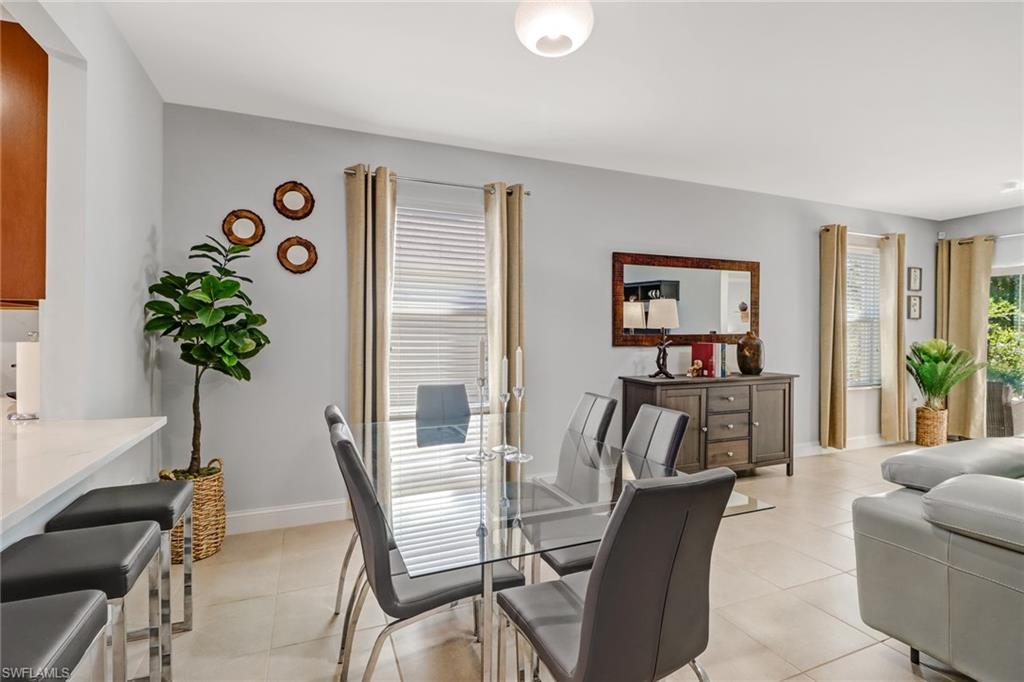 690 Hadley Place East Naples, FL 34104 - Photo 6 of 27 a living room with furniture and a potted plant
