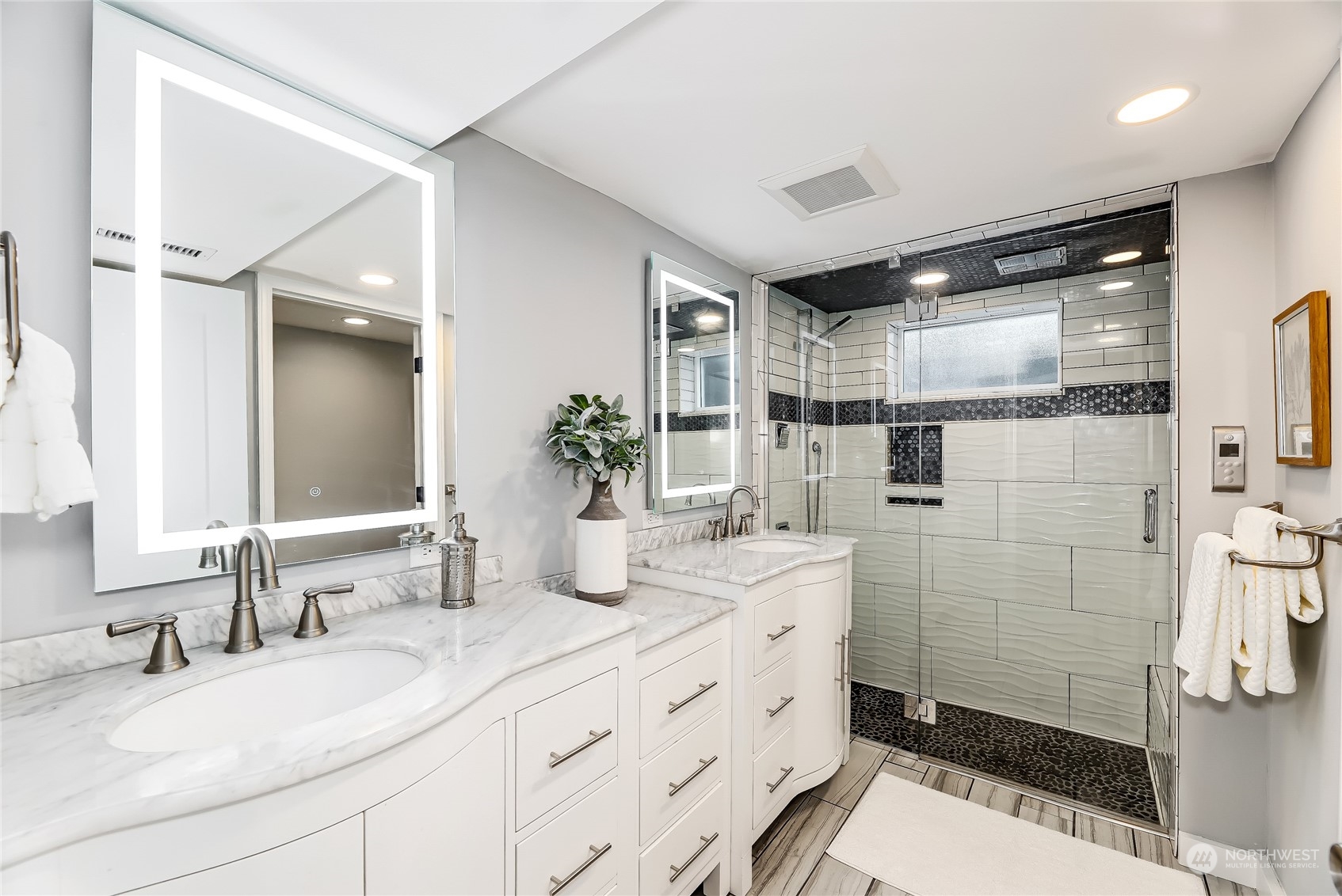 365 Northwest 47th Street Seattle, WA 98107 - Photo 13 of 31 a bathroom with a double vanity sink mirror and shower