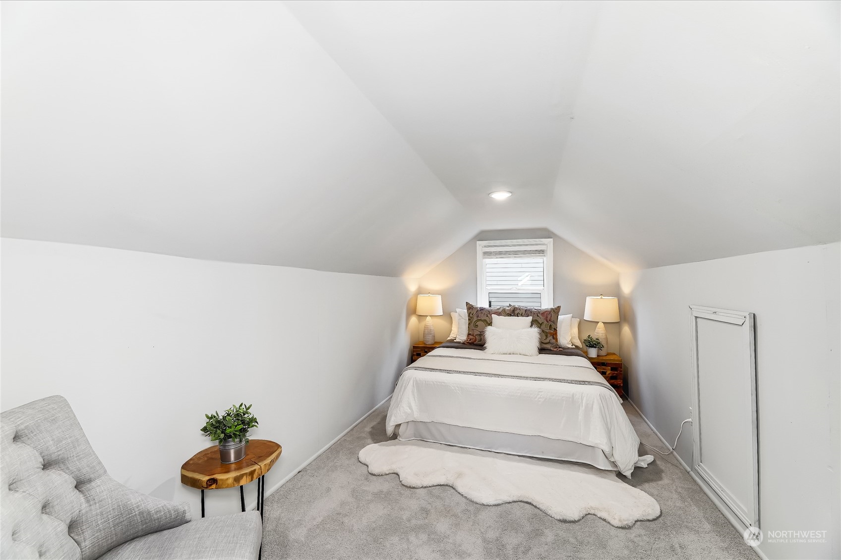 365 Northwest 47th Street Seattle, WA 98107 - Photo 18 of 31 a bed room with a bed and a chair