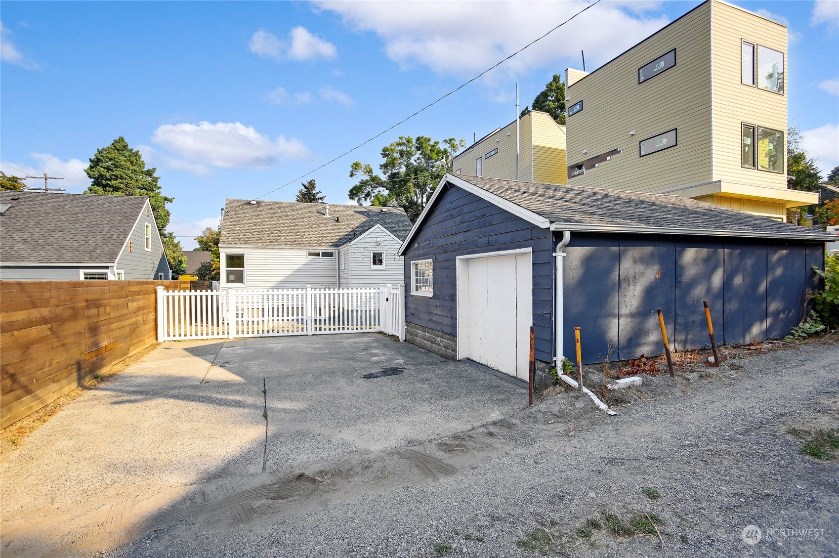 365 Northwest 47th Street Seattle, WA 98107 - Photo 23 of 31 a view of a house with a backyard and a chair