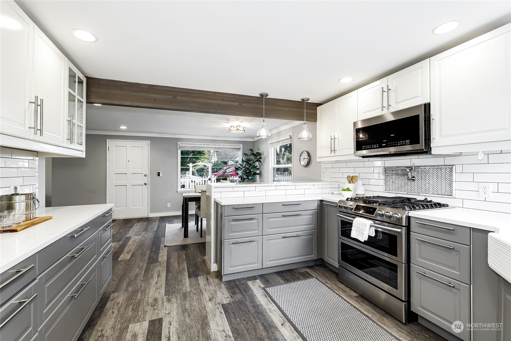 365 Northwest 47th Street Seattle, WA 98107 - Photo 5 of 31 a kitchen with appliances a sink and cabinets
