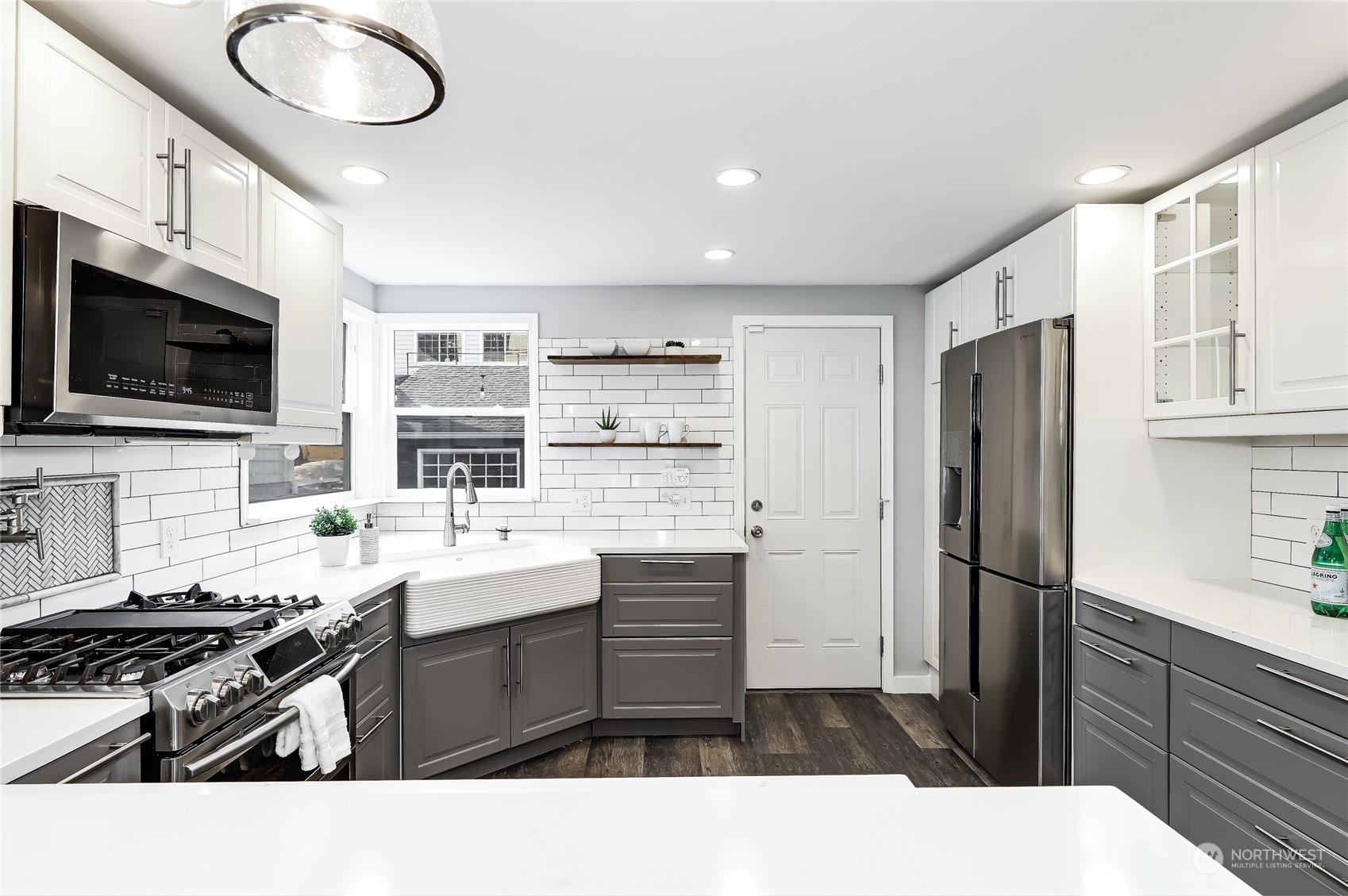 365 Northwest 47th Street Seattle, WA 98107 - Photo 6 of 31 a kitchen with a sink stainless steel appliances and cabinets