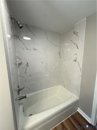 a close view of a bathtub in bathroom