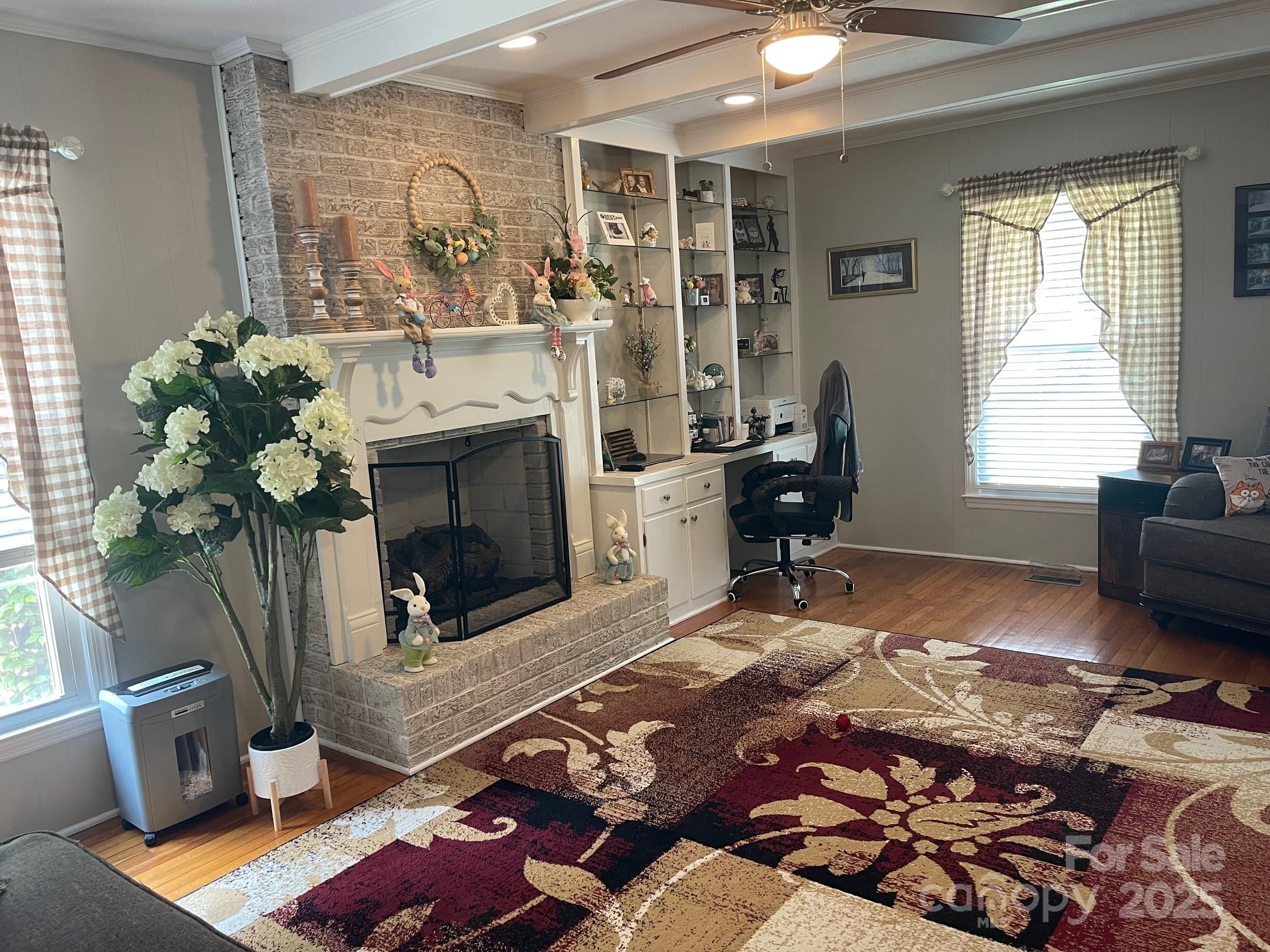 107 Calhoun Drive Cheraw, SC 29520 - Photo 4 of 16 a living room with furniture bathtub and a fireplace