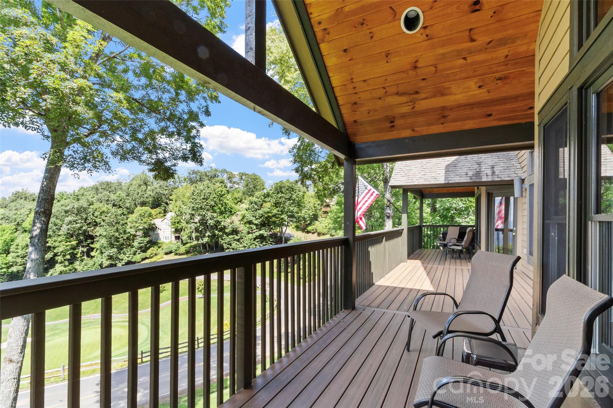 91 Brandy Run Road Burnsville, NC 28714 - Photo 13 of 45 a view of a chairs and table in patio with wooden floor