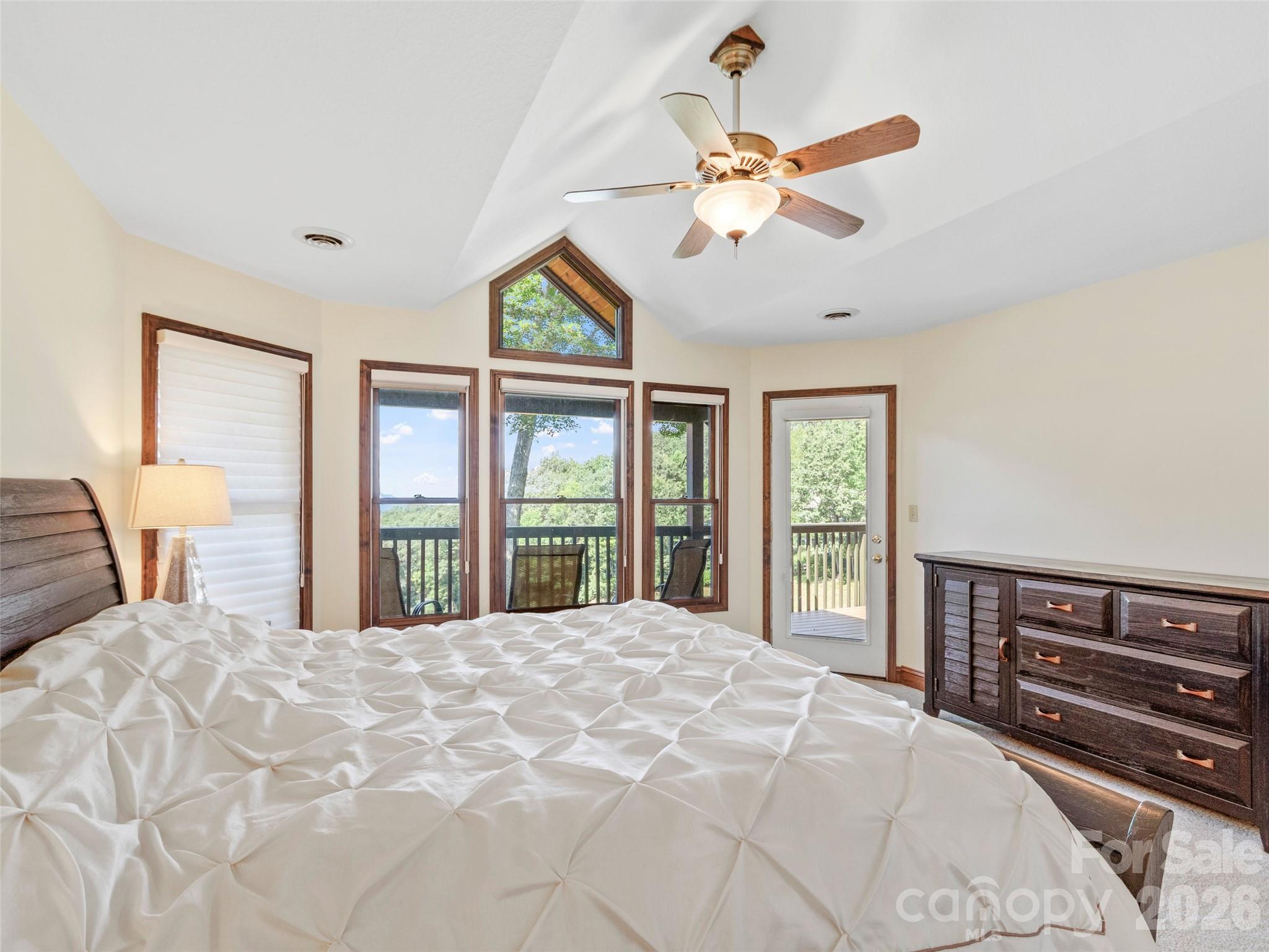 91 Brandy Run Road Burnsville, NC 28714 - Photo 18 of 45 a bedroom with a large bed and a large window