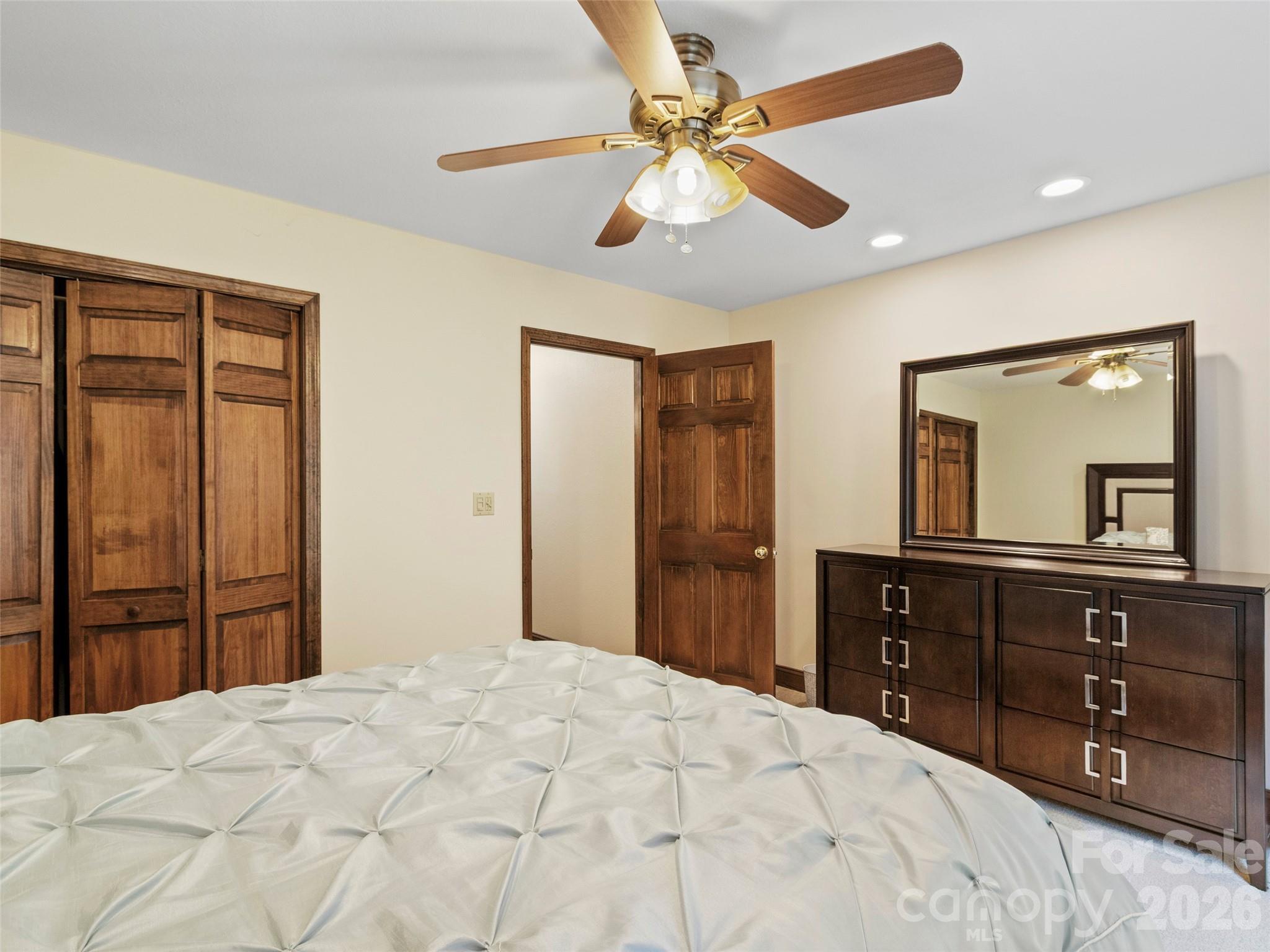 91 Brandy Run Road Burnsville, NC 28714 - Photo 25 of 45 a bedroom with a bed and a dresser