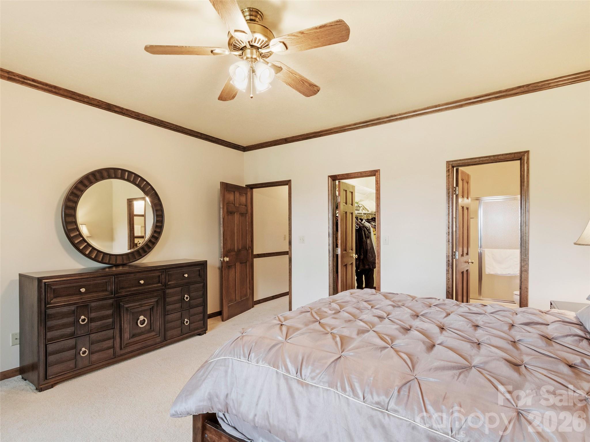 91 Brandy Run Road Burnsville, NC 28714 - Photo 35 of 45 a bedroom with a bed and a dresser
