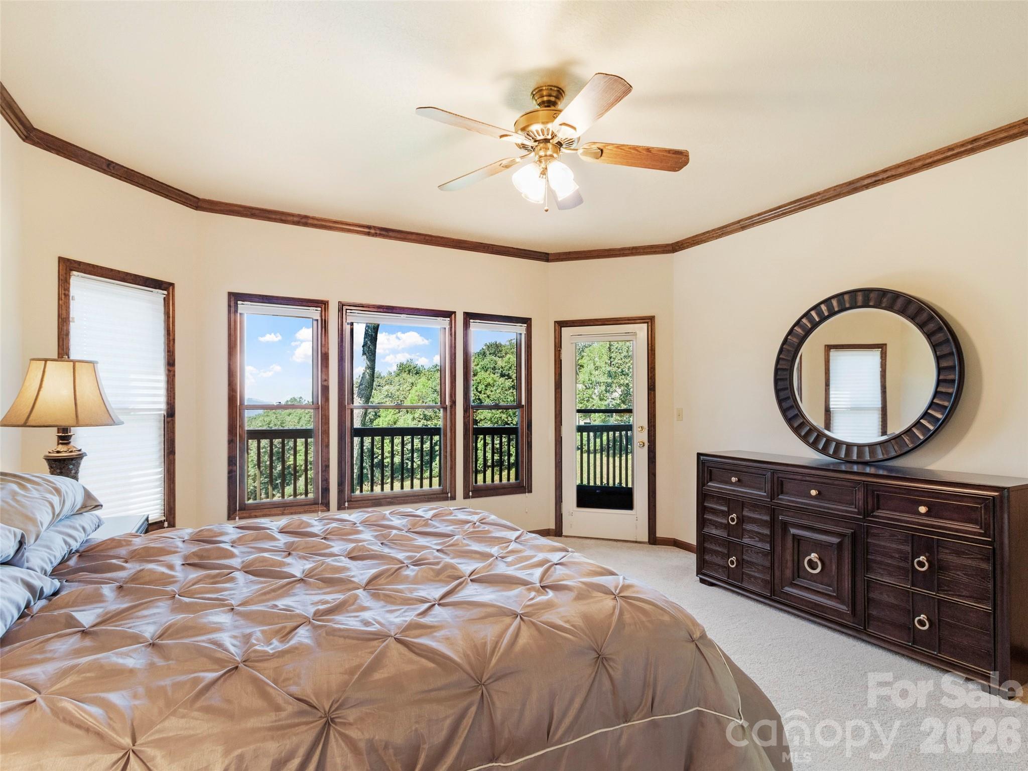 91 Brandy Run Road Burnsville, NC 28714 - Photo 37 of 45 a bedroom with a large bed and a large window