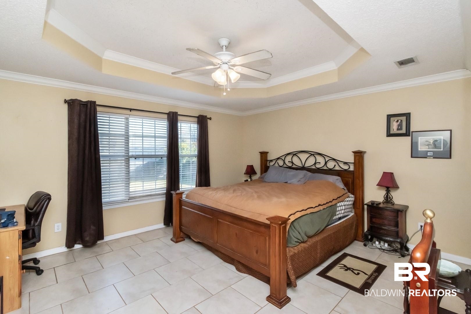 29221 Canterbury Road Daphne, AL 36526 - Photo 11 of 17 Bedroom featuring a raised ceiling, ceiling fan, and crown molding