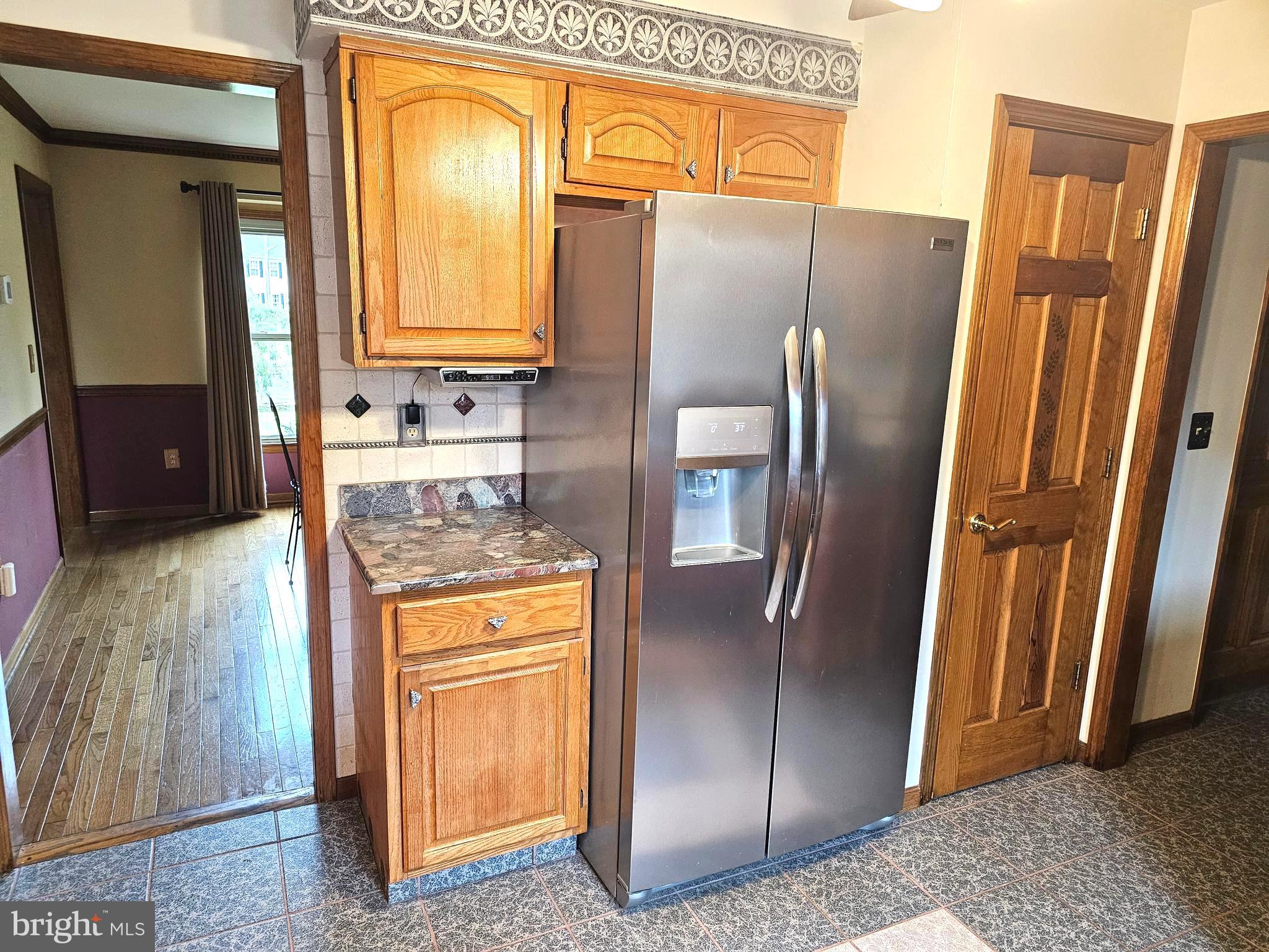 9 Timber Wolf Drive Hamilton, NJ 08620 - Photo 13 of 48 a metallic refrigerator freezer sitting in a kitchen