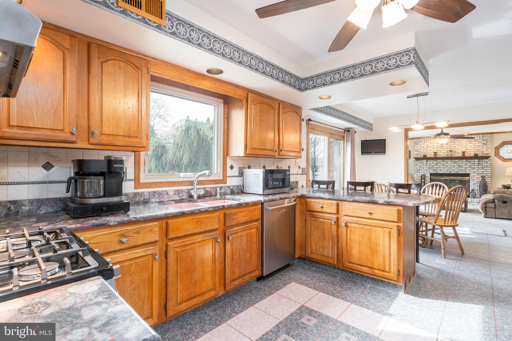 9 Timber Wolf Drive Hamilton, NJ 08620 - Photo 14 of 48 a kitchen with stainless steel appliances granite countertop a stove and a sink