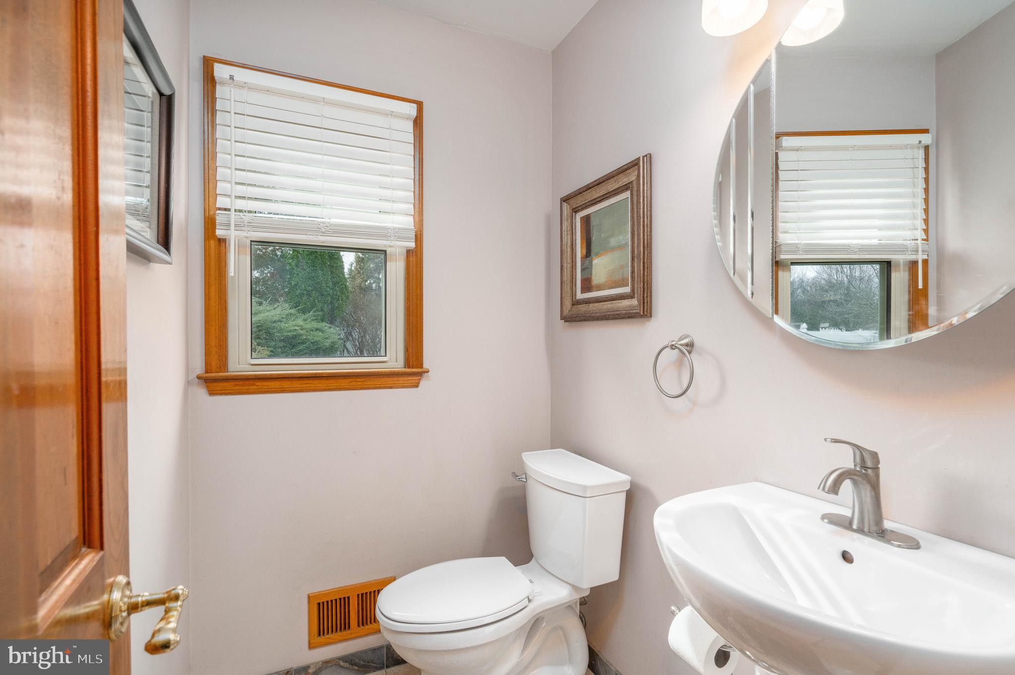 9 Timber Wolf Drive Hamilton, NJ 08620 - Photo 18 of 48 a bathroom with a toilet a sink and a mirror