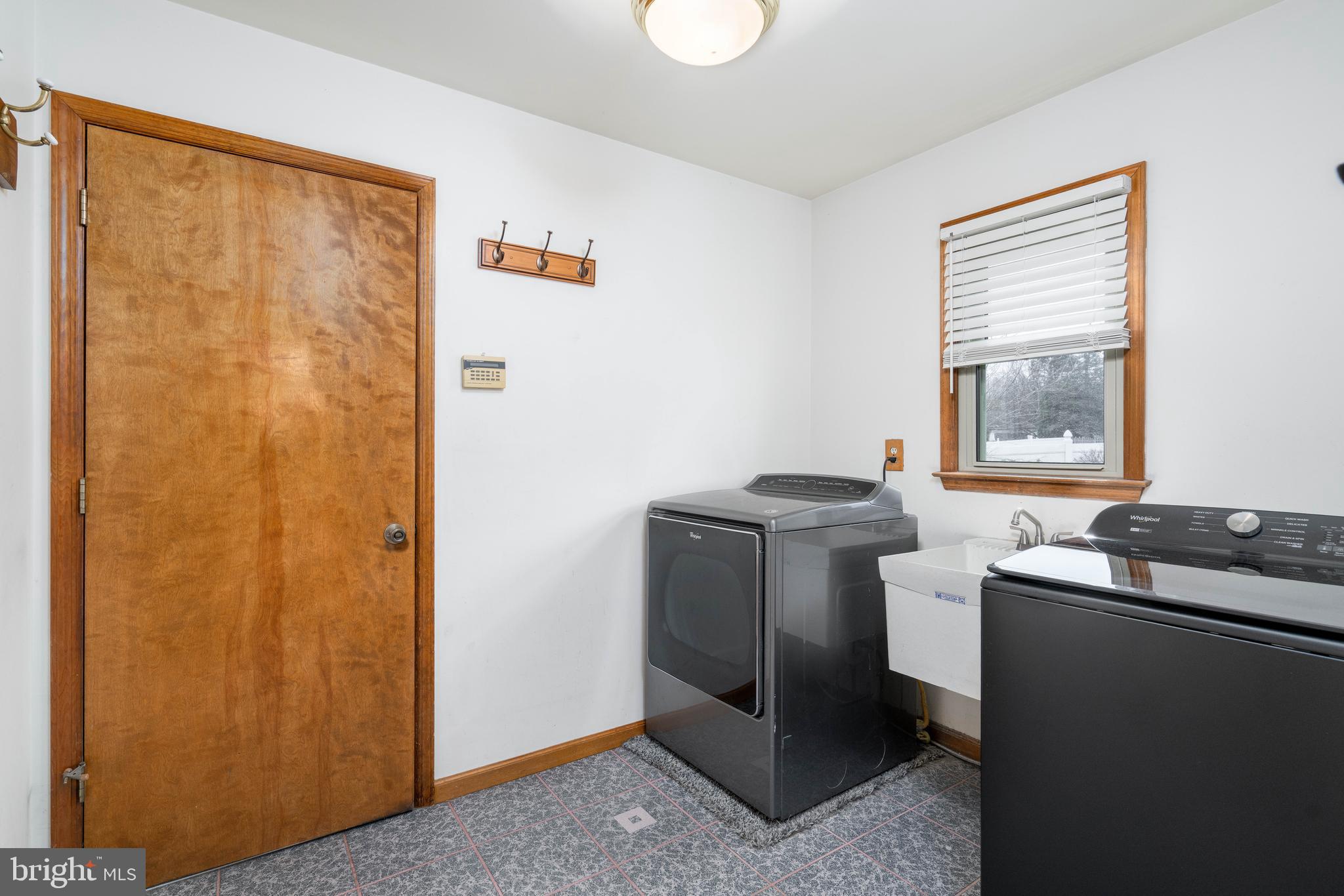 9 Timber Wolf Drive Hamilton, NJ 08620 - Photo 19 of 48 a utility room with a window dryer and washer