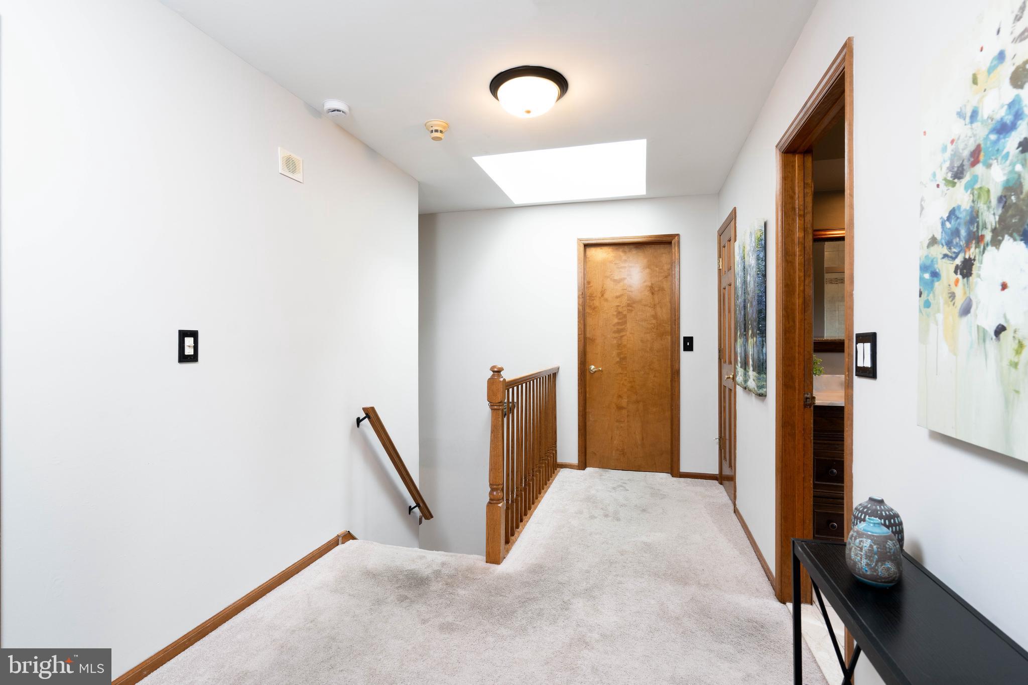 9 Timber Wolf Drive Hamilton, NJ 08620 - Photo 21 of 48 a view of a hallway to a room with windows