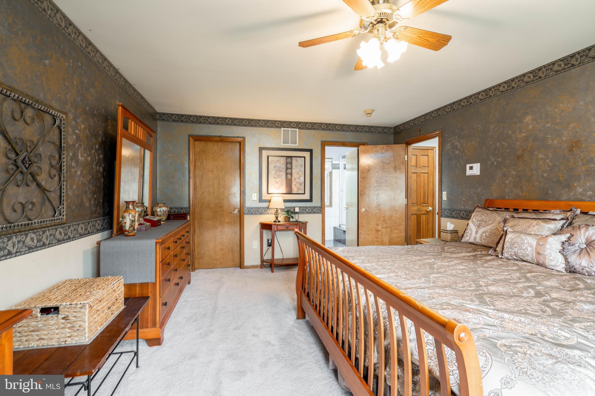9 Timber Wolf Drive Hamilton, NJ 08620 - Photo 29 of 48 a bedroom with furniture and a chandelier