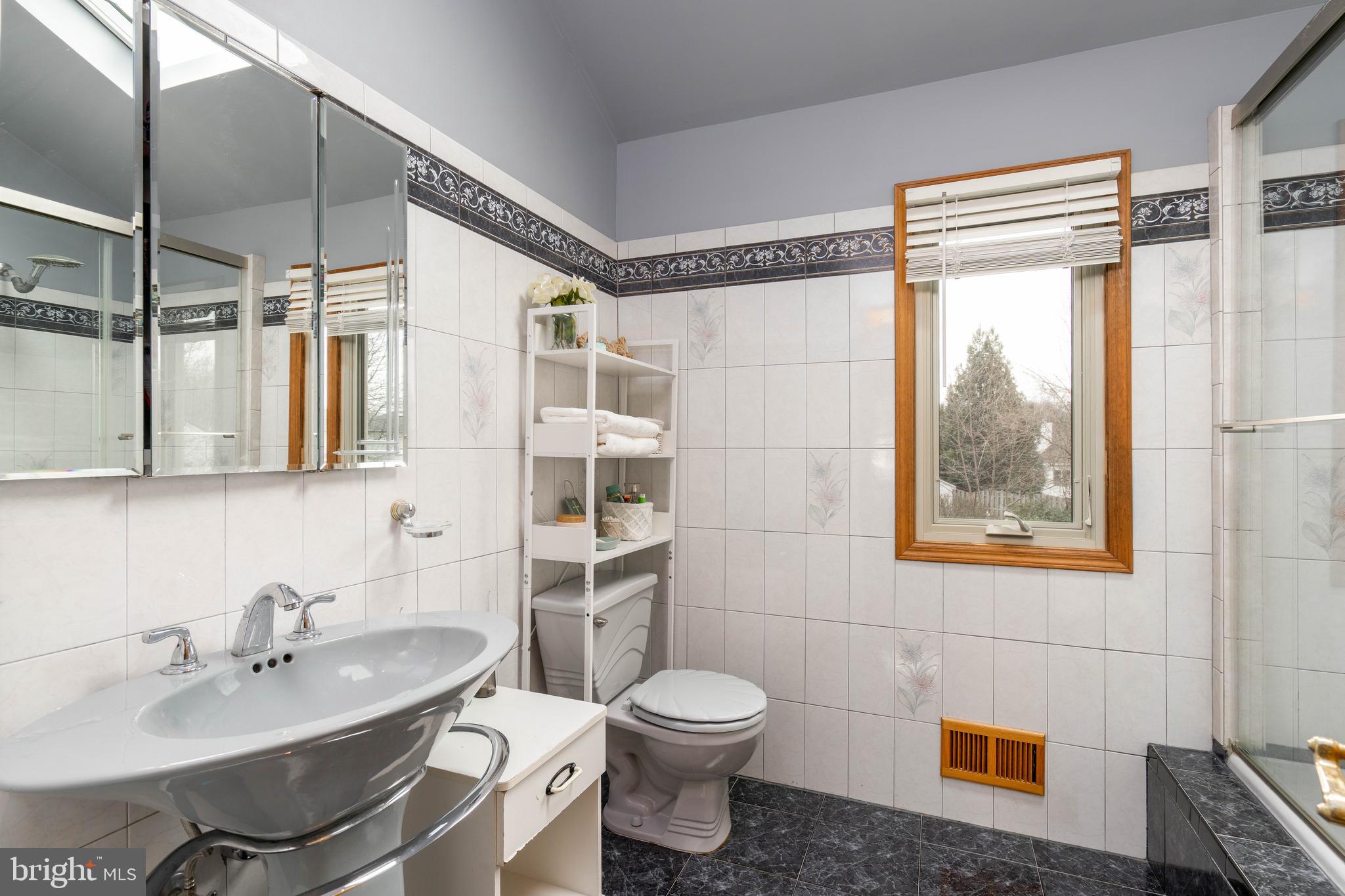 9 Timber Wolf Drive Hamilton, NJ 08620 - Photo 30 of 48 a bathroom with a sink toilet and shower