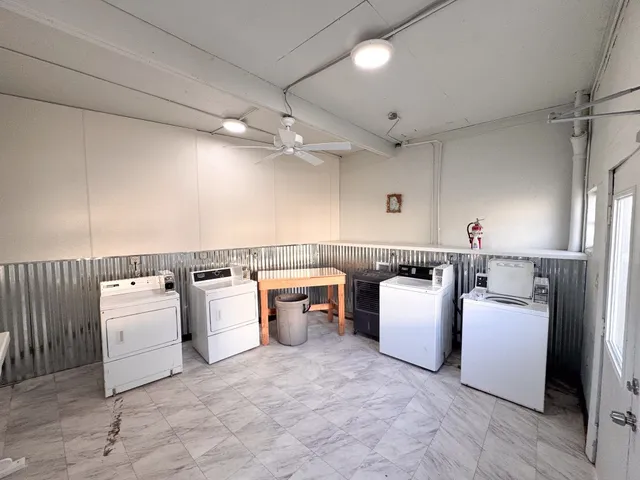 a kitchen with cabinets and appliances