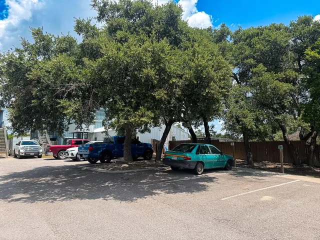 a view of street with parked cars