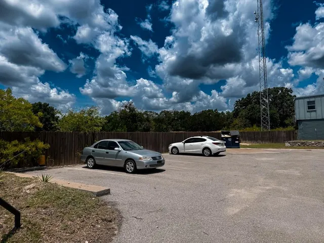 a view of street with parked cars