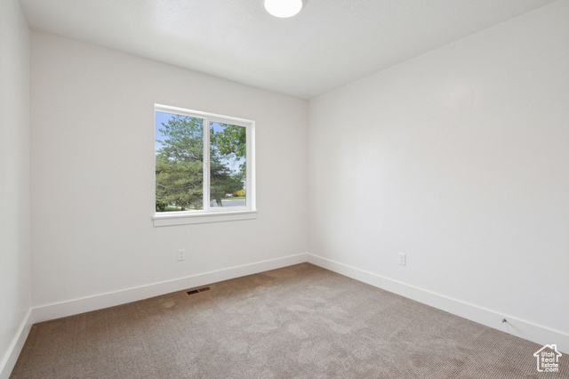 1615 North Angel Street, Unit I Layton, UT 84041 - Photo 21 of 56 Unfurnished room with carpet flooring and baseboards