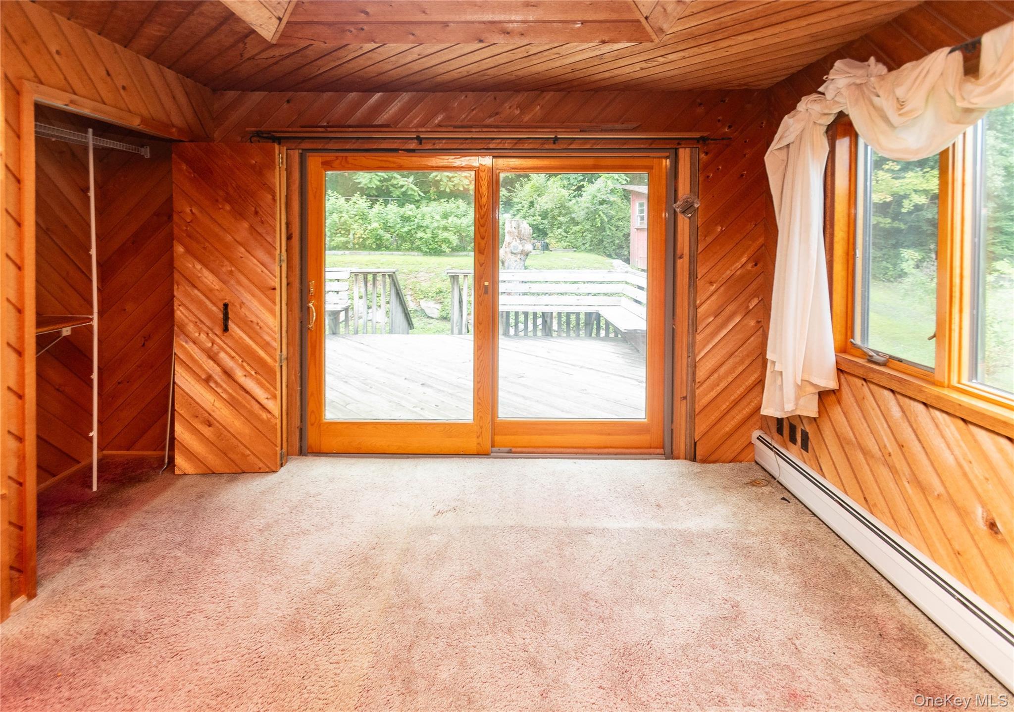 105 Jarmain Road Monroe, NY 10950 - Photo 19 of 40 a view of an empty room with a fireplace and a large window