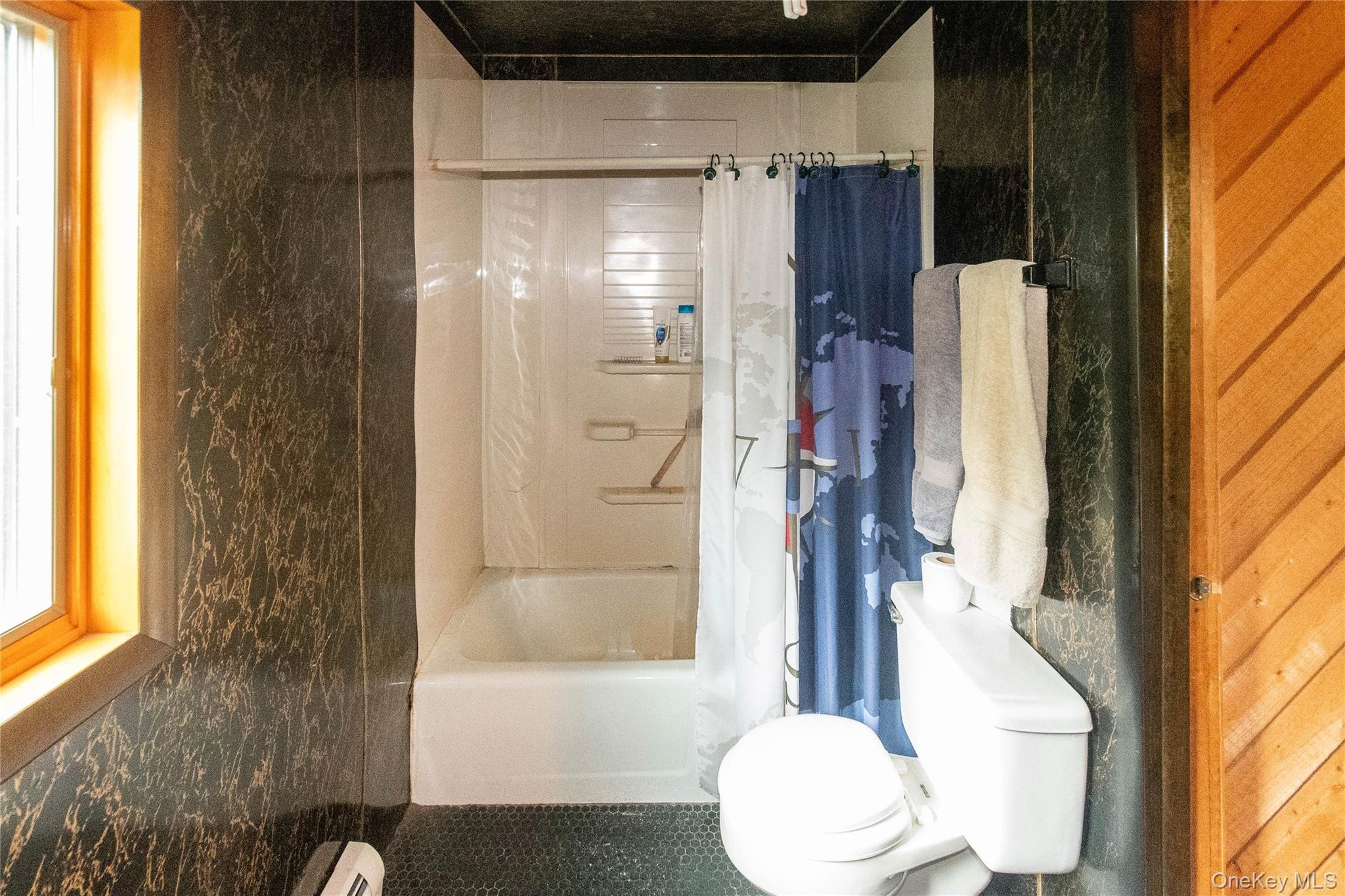 105 Jarmain Road Monroe, NY 10950 - Photo 24 of 40 a bathroom with a bathtub and a shower