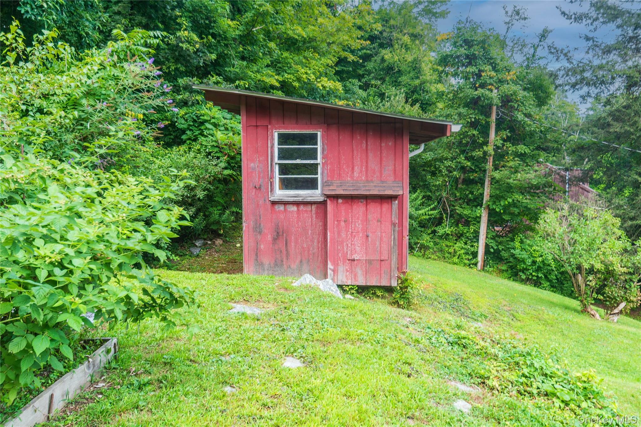105 Jarmain Road Monroe, NY 10950 - Photo 32 of 40 a view of a small barn in the middle of a yard