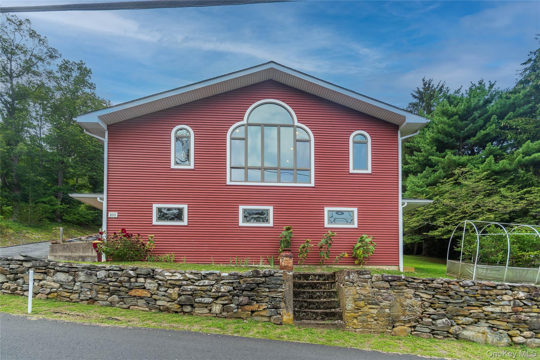 105 Jarmain Road Monroe, NY 10950 - Photo 35 of 40 a front view of a house with garden