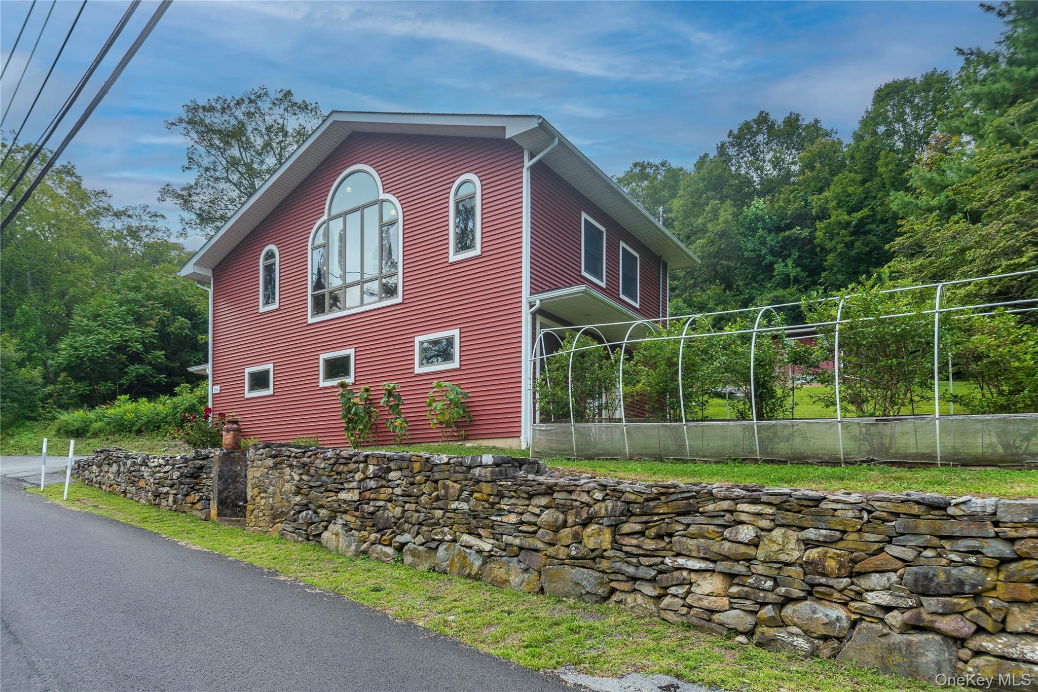 105 Jarmain Road Monroe, NY 10950 - Photo 36 of 40 a front view of a house with a garden