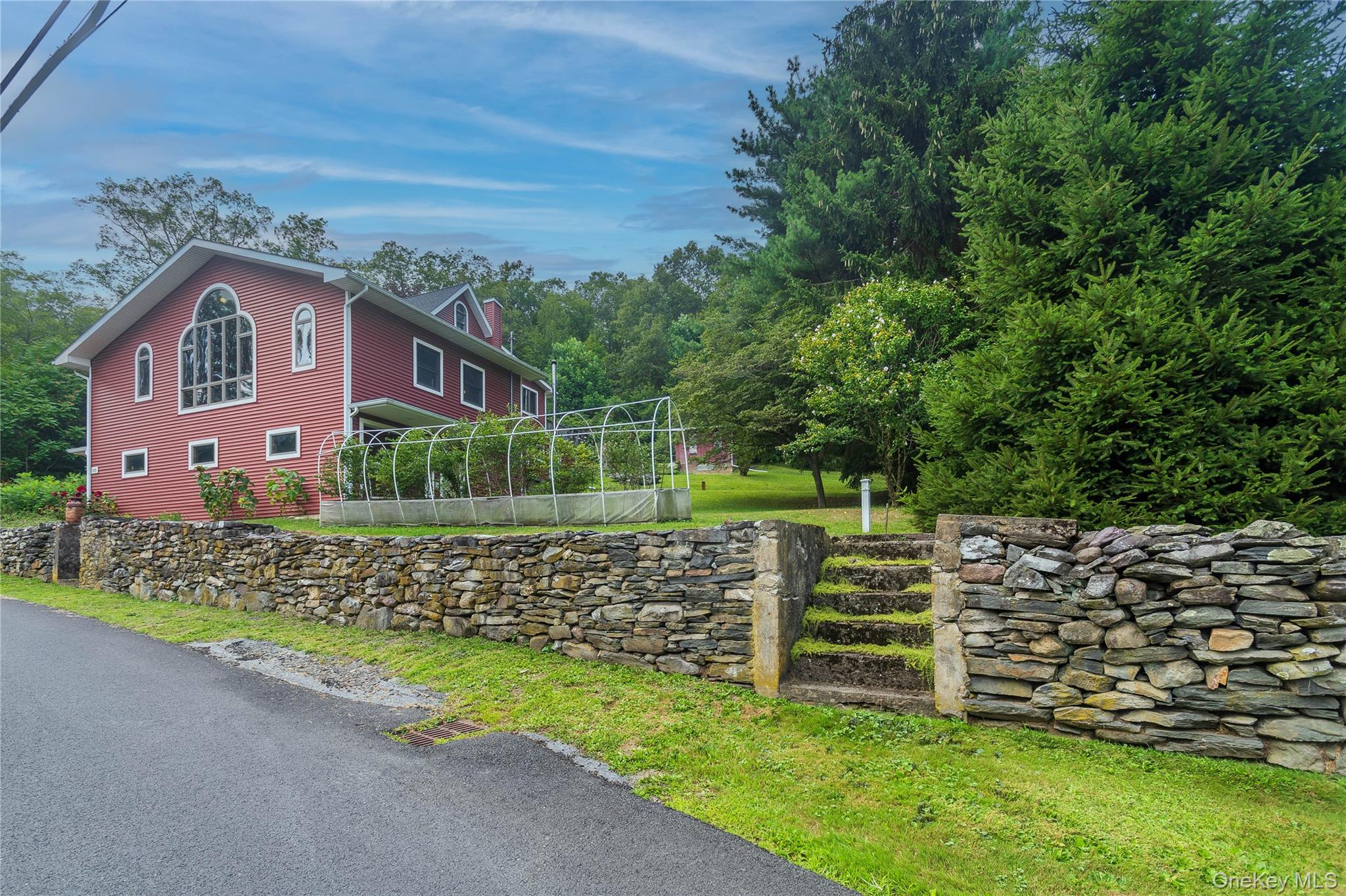105 Jarmain Road Monroe, NY 10950 - Photo 37 of 40 a front view of a house with a garden