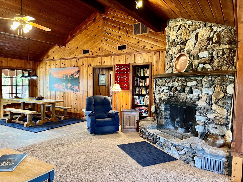 29555 Wyle Ranch Road North Fork, CA 93643 - Photo 16 of 70 a living room with furniture a fireplace and a table