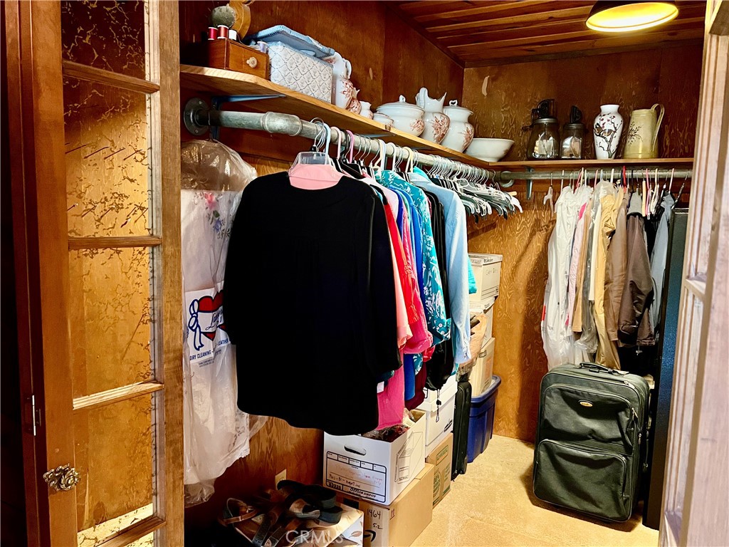 29555 Wyle Ranch Road North Fork, CA 93643 - Photo 33 of 70 a view of walk in closet with clothes and shoes