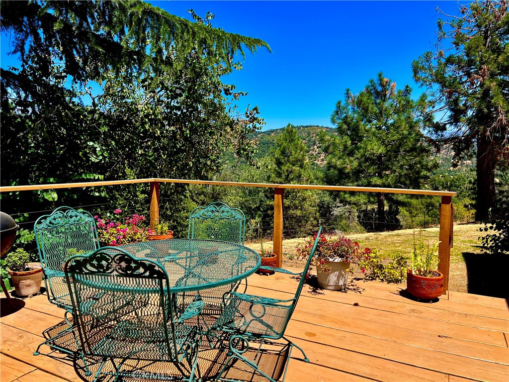 29555 Wyle Ranch Road North Fork, CA 93643 - Photo 40 of 70 a view of a chairs and table on the deck