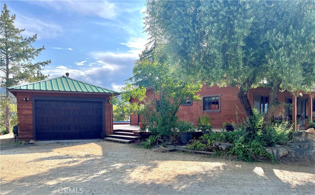 29555 Wyle Ranch Road North Fork, CA 93643 - Photo 4 of 70 a front view of a house with a yard