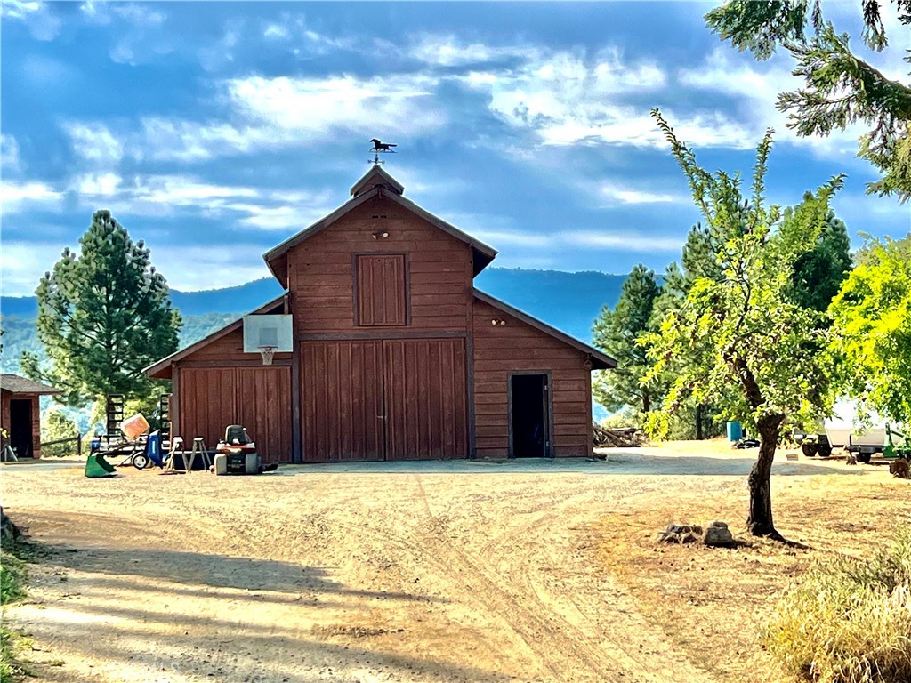 29555 Wyle Ranch Road North Fork, CA 93643 - Photo 5 of 70 a view of a house with a yard covered with snow