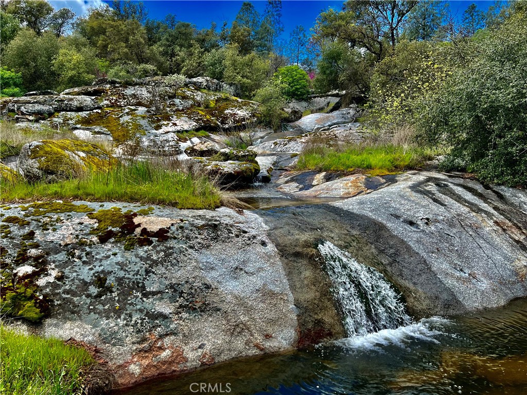 29555 Wyle Ranch Road North Fork, CA 93643 - Photo 62 of 70 a view of a street with a yard