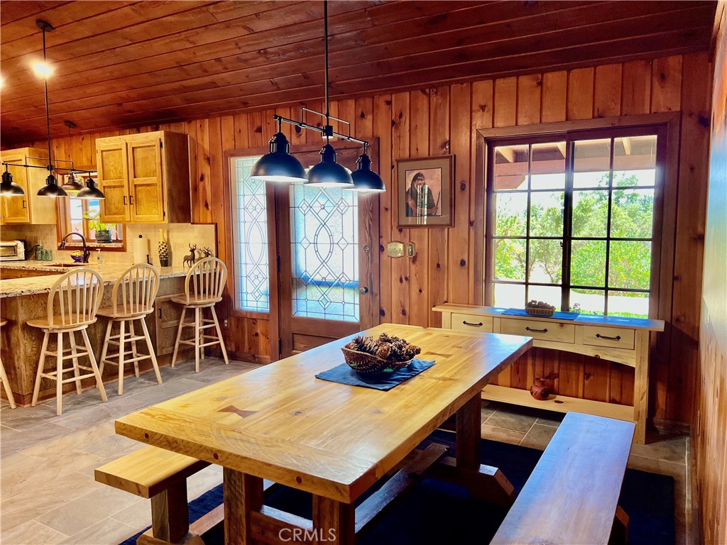 29555 Wyle Ranch Road North Fork, CA 93643 - Photo 8 of 70 a view of a dining room with furniture window and wooden floor